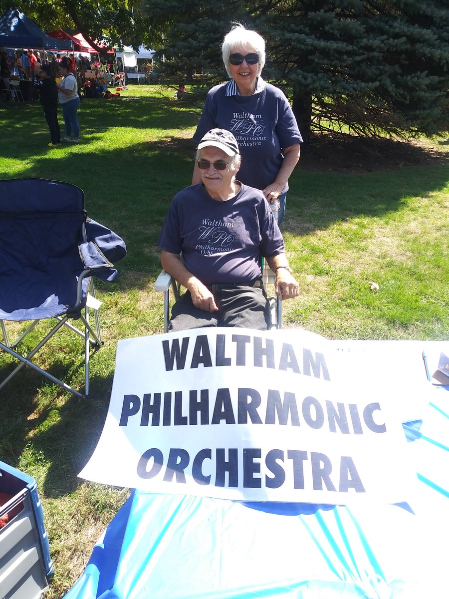 Board Members Artie and Karen "bask" in the sun at the  wonderful Waltham Day on the Common, waiting for the many visitors who want to learn about the WPO.