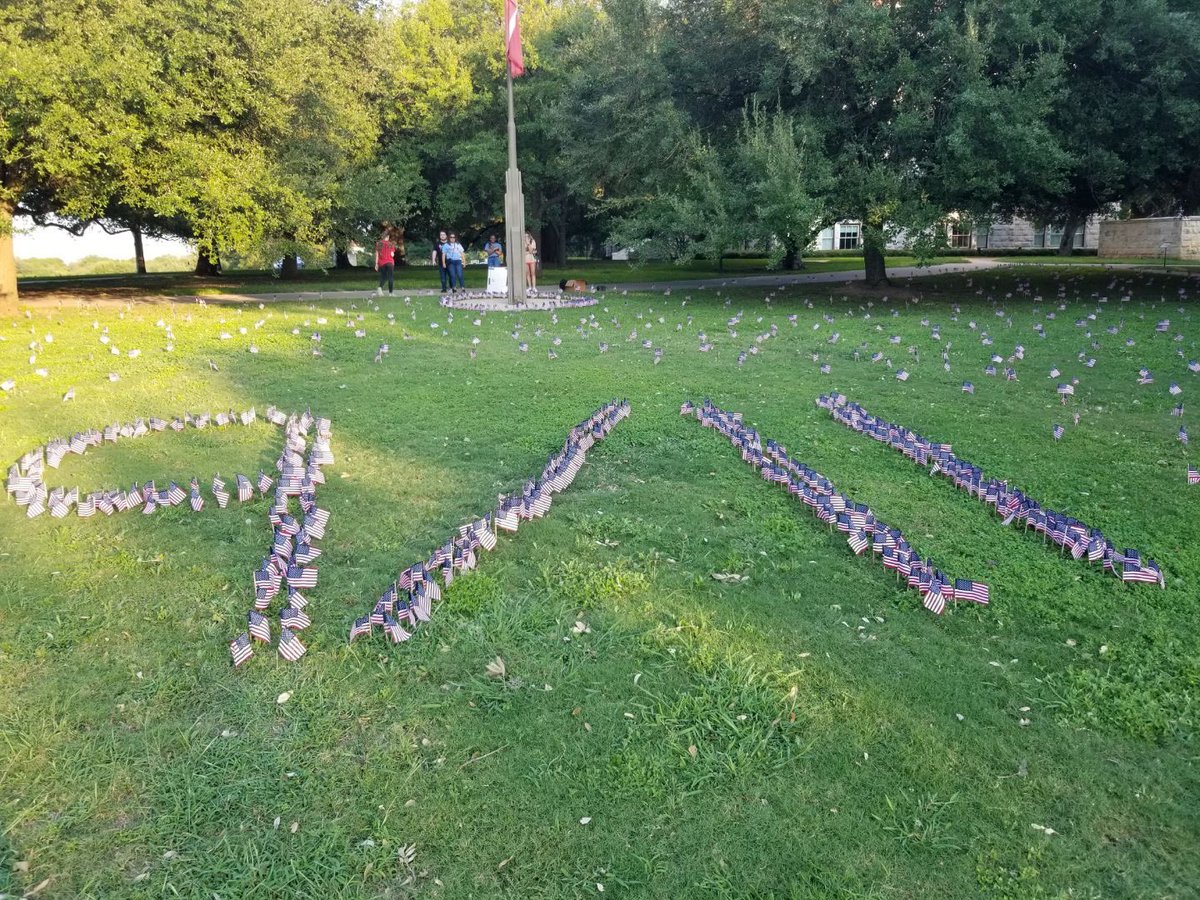 seuycf's tweet photo. Today marks the 21st anniversary of the darkest day in American history. In honor of the fallen, we planted 3,000 Americans on Holy Cross Lawn for those who lost their lives on September 11th. Come out for a moment of silence for those who lost their lives. We will never forget. https://t.co/mDV5Iak75z