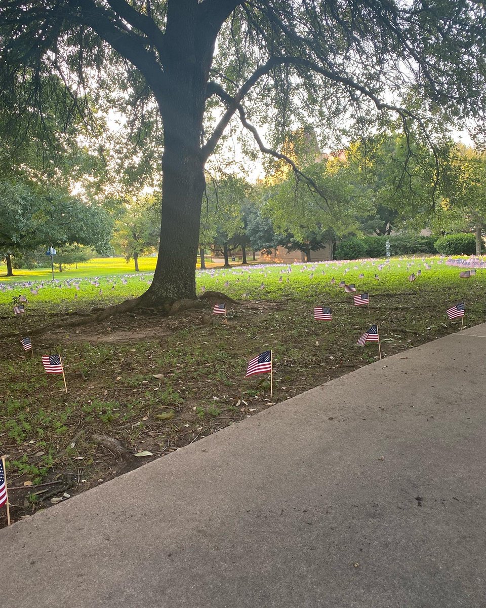 seuycf's tweet photo. Today marks the 21st anniversary of the darkest day in American history. In honor of the fallen, we planted 3,000 Americans on Holy Cross Lawn for those who lost their lives on September 11th. Come out for a moment of silence for those who lost their lives. We will never forget. https://t.co/mDV5Iak75z