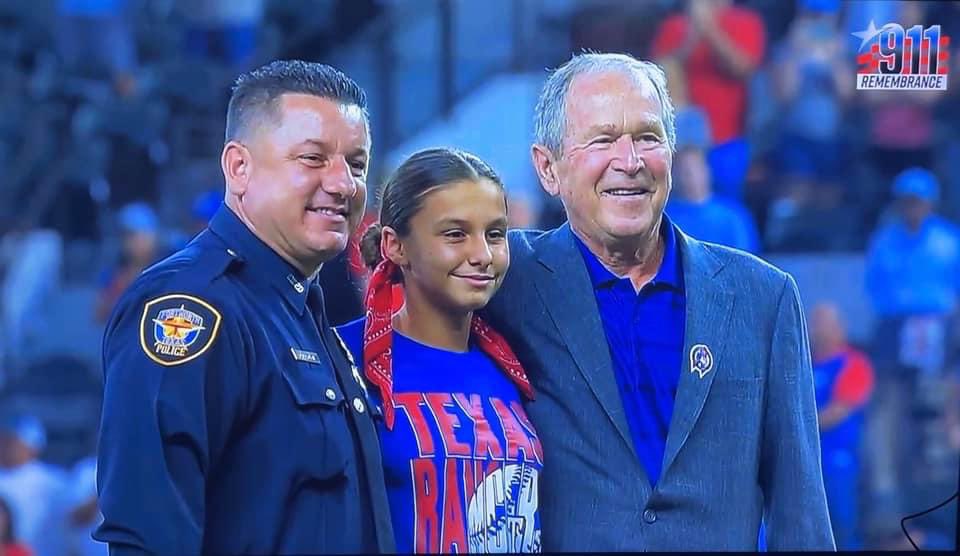 Brotherhoodfwt2's tweet photo. Our president and his daughter who throughout the first ceremonial pitch for today’s game @Rangers in honor of 9/11.

@GeorgeWBush__ brought the baseball to the mound for her to throw.

What an honor🇺🇸 https://t.co/Igcq3mHi9t