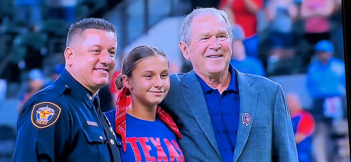 Brotherhoodfwt2's tweet photo. Our president and his daughter who throughout the first ceremonial pitch for today’s game @Rangers in honor of 9/11.

@GeorgeWBush__ brought the baseball to the mound for her to throw.

What an honor🇺🇸 https://t.co/Igcq3mHi9t