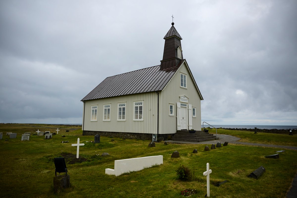 Judge_Burgess's tweet photo. Recently spent a rainy morning at #Strandarkirkja ("Beach Church") on the south coast of #Iceland, built where in legend an angel guided a group storm-tossed sailors through the surf and into a sheltered bay. It is watched over by a granite sculpture of the angel. Cool. ๐ท๐จโโ๏ธ๐ฎ๐ธ https://t.co/mhL8SyVYPZ
