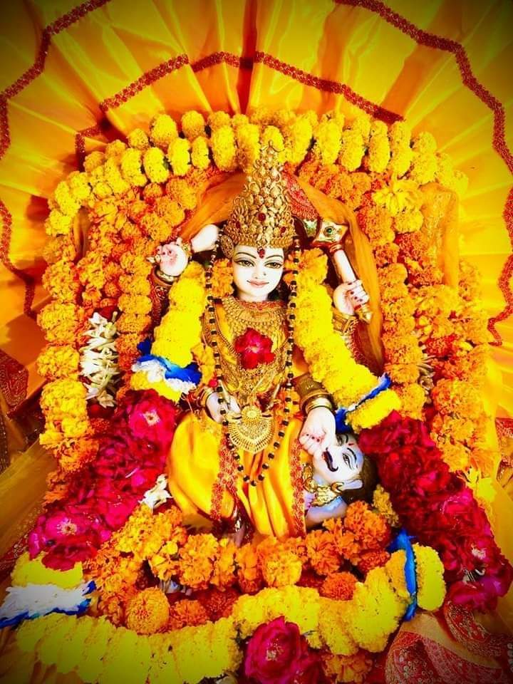 Maa Baglamukhi is propitiated with yellow offerings by devotees dressed in yellow, seated on a yellow cloth.