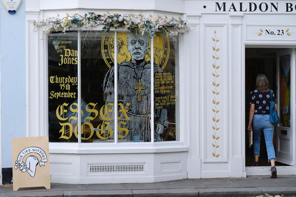 Father a priest turned drunken and devilish by the horrors of war, featuring in the windows of <a href="/BooksMaldon/">Maldon Books</a> painted by <a href="/ourtinywindows/">Our Tiny Windows</a>

#EssexDogs the epic new adventure by Dan Jones (<a href="/dgjones/">Dan Jones</a>) 

Get tickets for the signing on the 15th of September now: bit.ly/3L6rrV2