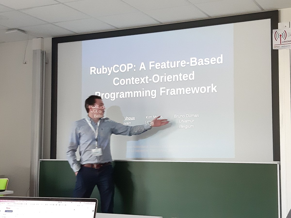 kim_mens's tweet photo. @benoit_duhoux from @UCLouvain_be pointing to his copromotor from UNamur @Blackberu. Presentation on feature-based context-oriented programming @benevol22 https://t.co/fiMHX7bQor