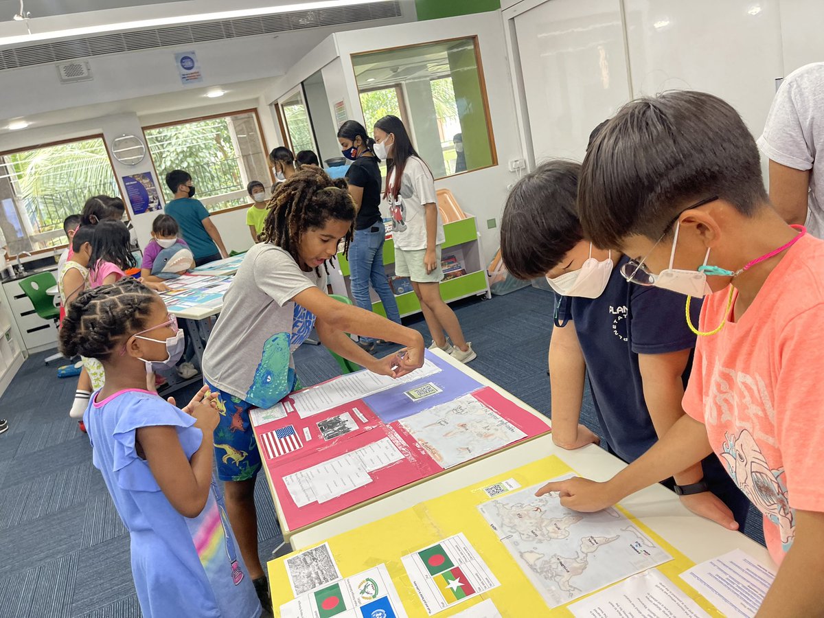 AISCElementary's tweet photo. So surreal to have moments like these back on campus!Fifth graders sharing their research on human migration with an enthusiastic second grade bunch! 2MS learned what it means to present an artifact at a museum from the expert 5BT docents. #AISCGrade2 #AISCElementary #AISCGrade5 https://t.co/FV5t6PXl5i