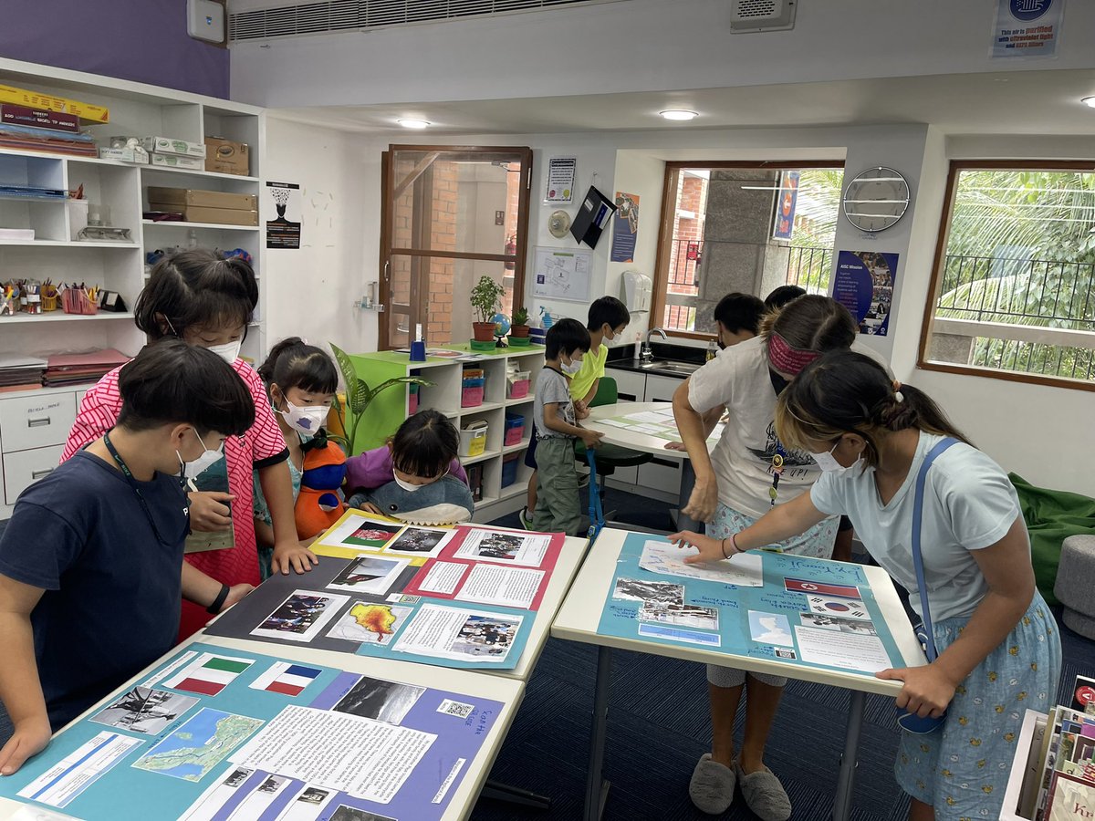 AISCElementary's tweet photo. So surreal to have moments like these back on campus!Fifth graders sharing their research on human migration with an enthusiastic second grade bunch! 2MS learned what it means to present an artifact at a museum from the expert 5BT docents. #AISCGrade2 #AISCElementary #AISCGrade5 https://t.co/FV5t6PXl5i