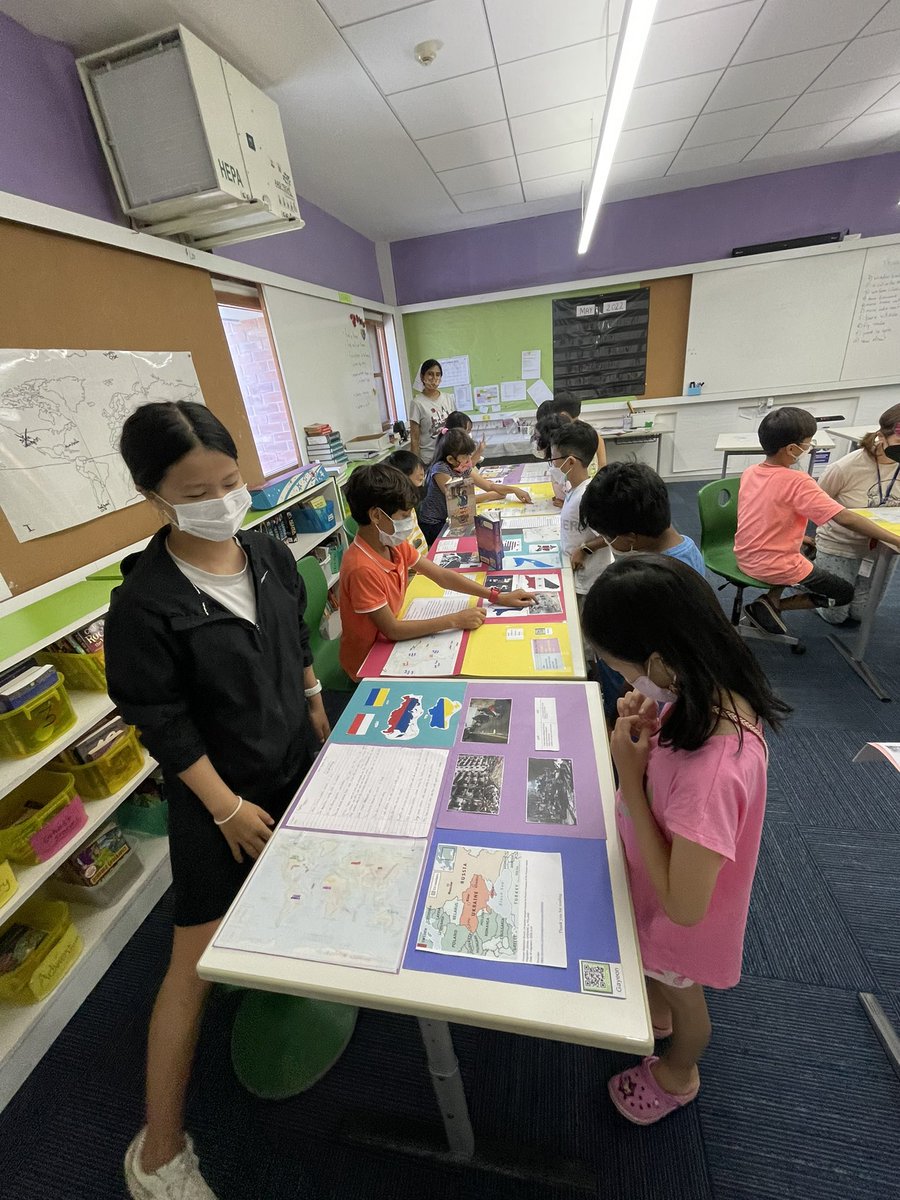 AISCElementary's tweet photo. So surreal to have moments like these back on campus!Fifth graders sharing their research on human migration with an enthusiastic second grade bunch! 2MS learned what it means to present an artifact at a museum from the expert 5BT docents. #AISCGrade2 #AISCElementary #AISCGrade5 https://t.co/FV5t6PXl5i