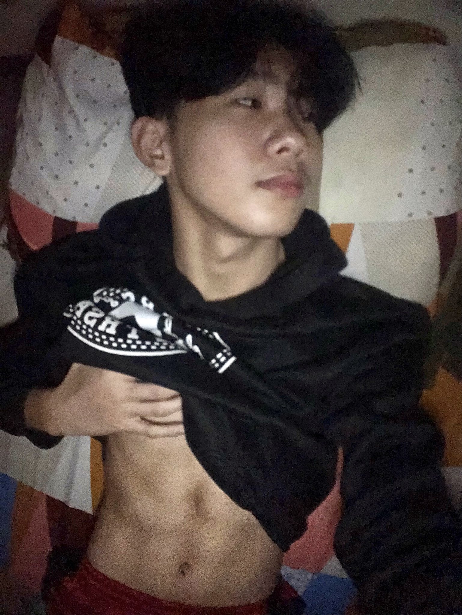 A young man confidently holds his crotch, his image going viral.