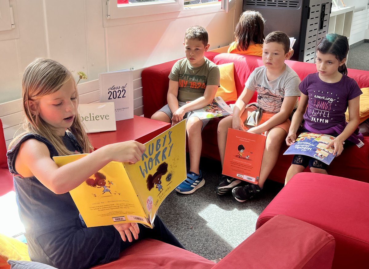 ISR_library's tweet photo. #ISRprimary students started an impromptu read-aloud and story-telling session during break, sharing new books and some old favourites too! https://t.co/k7ocTyL1xs