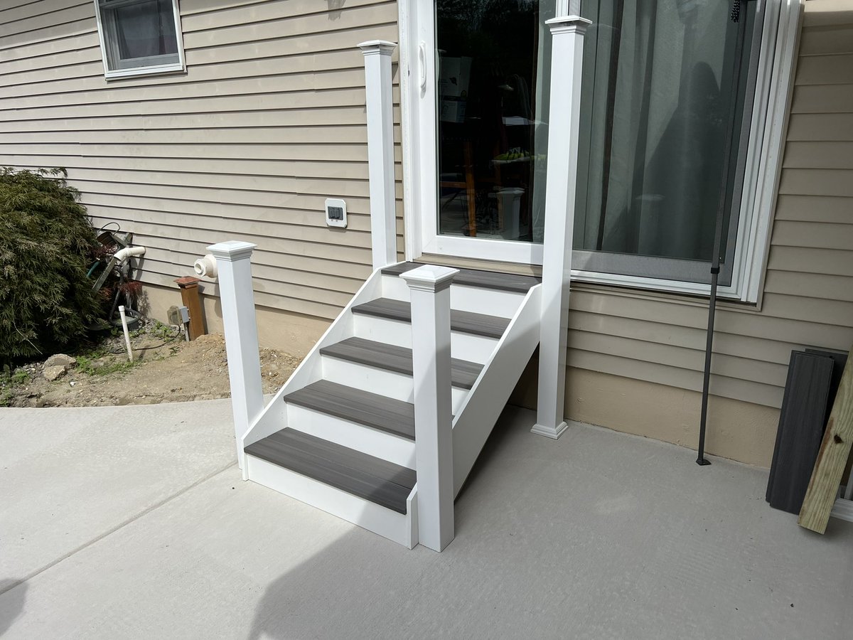 JohnSam101970's tweet photo. Got rid of old deck &amp; replaced with a concrete patio. Had to build new stairs. Went with lower rise steps to make it easier for us old folk. 😜 Just have to add the railings when the rain goes away. #happywifehappylife https://t.co/QyL6Kj3Ej6
