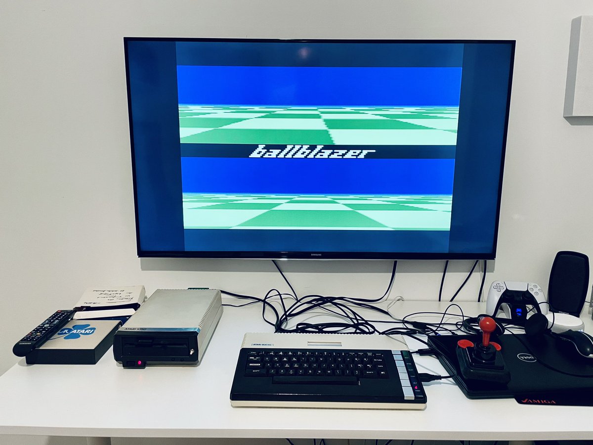 mnemo's tweet photo. Finally got around setting up the #Atari800XL again. #FujiNet is hidden behind the 1050 floppy drive. #Retrocomputing #AtariComputer #CompetitionPro #BallBlazer https://t.co/l1BkoNZ04Y