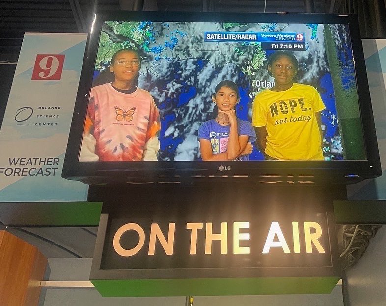 Students from Turie T Smalls reporting the weather and getting to go on stage to learn about elasticity at the Orlando Science Center!