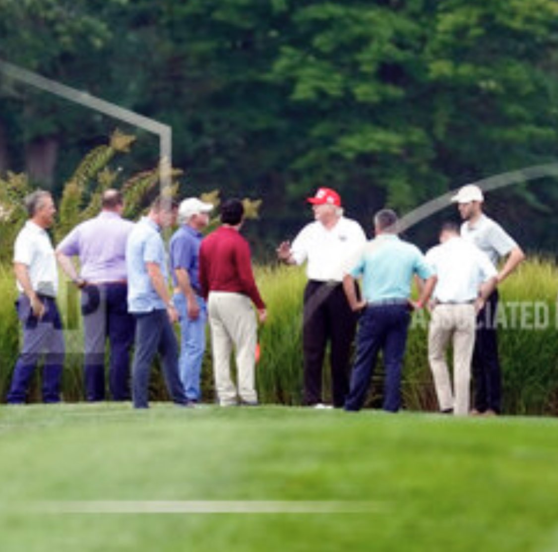 Trump and son Eric with unidentified individuals at Trump National Golf Course-DC, September 12, 2022 via AP
