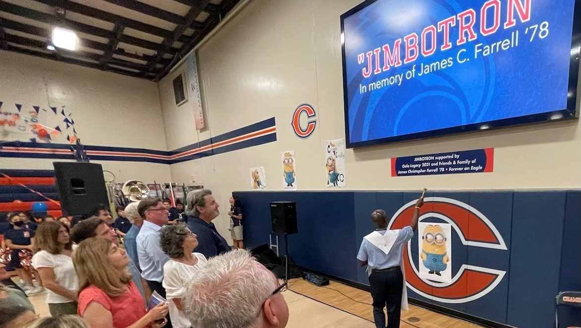 chaminadealumni's tweet photo. Last week we dedicated the new LED video wall in the gym, affectionately referred to as the “Jimbotron,” in honor of James C. Farrell ’78. The Jimbotron was made possible by generous donations from Jim’s family, friends, Chaminade alums, and funds from the 2021 Gala, Legacy. https://t.co/NMtEKacSDZ