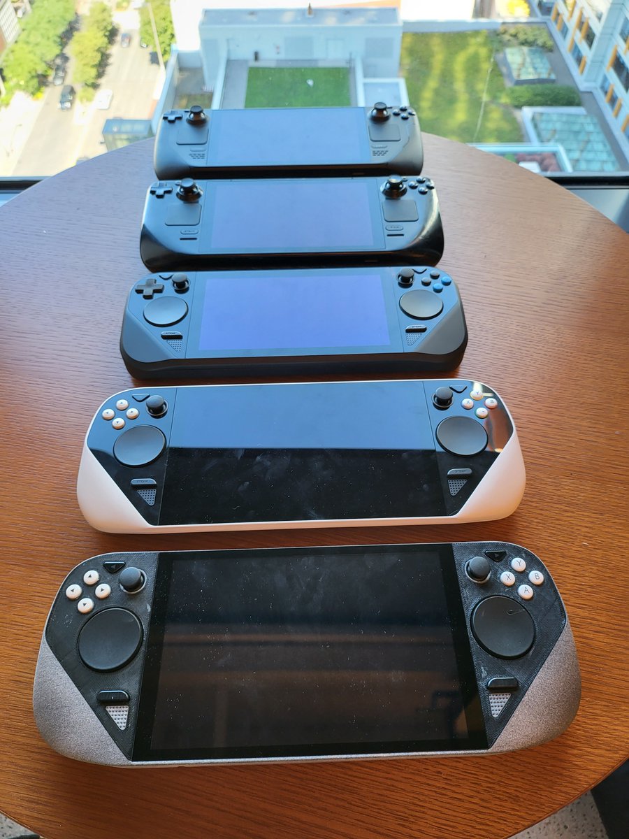 Plagman2's tweet photo. As part of the Asia launch press event, we made the design lab into a showroom of development history. My favorite are the playable prototypes: bootable Deck family tree from mid-2019 to now, from a couple of hand-built units onto gradual mass production. https://t.co/TpU5I8D50p