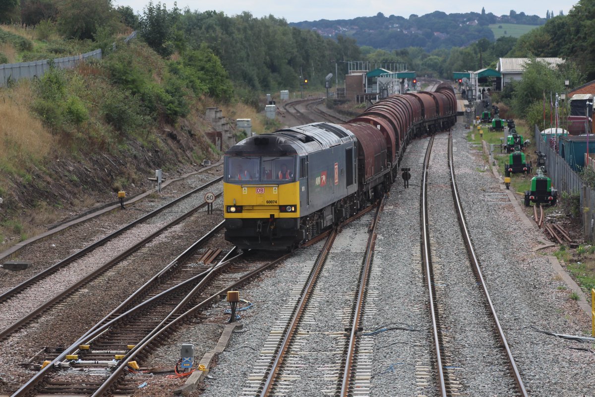 DB class 60 60074 snakes across from the Sheffield lines to the Old road to avoid Sheffield station on its way to Immingham from Wolverhampton . The 60 should have passed platform 3 but a class 195 had failed on its way to Nottingham so the 60 didn't use claycross north junction.