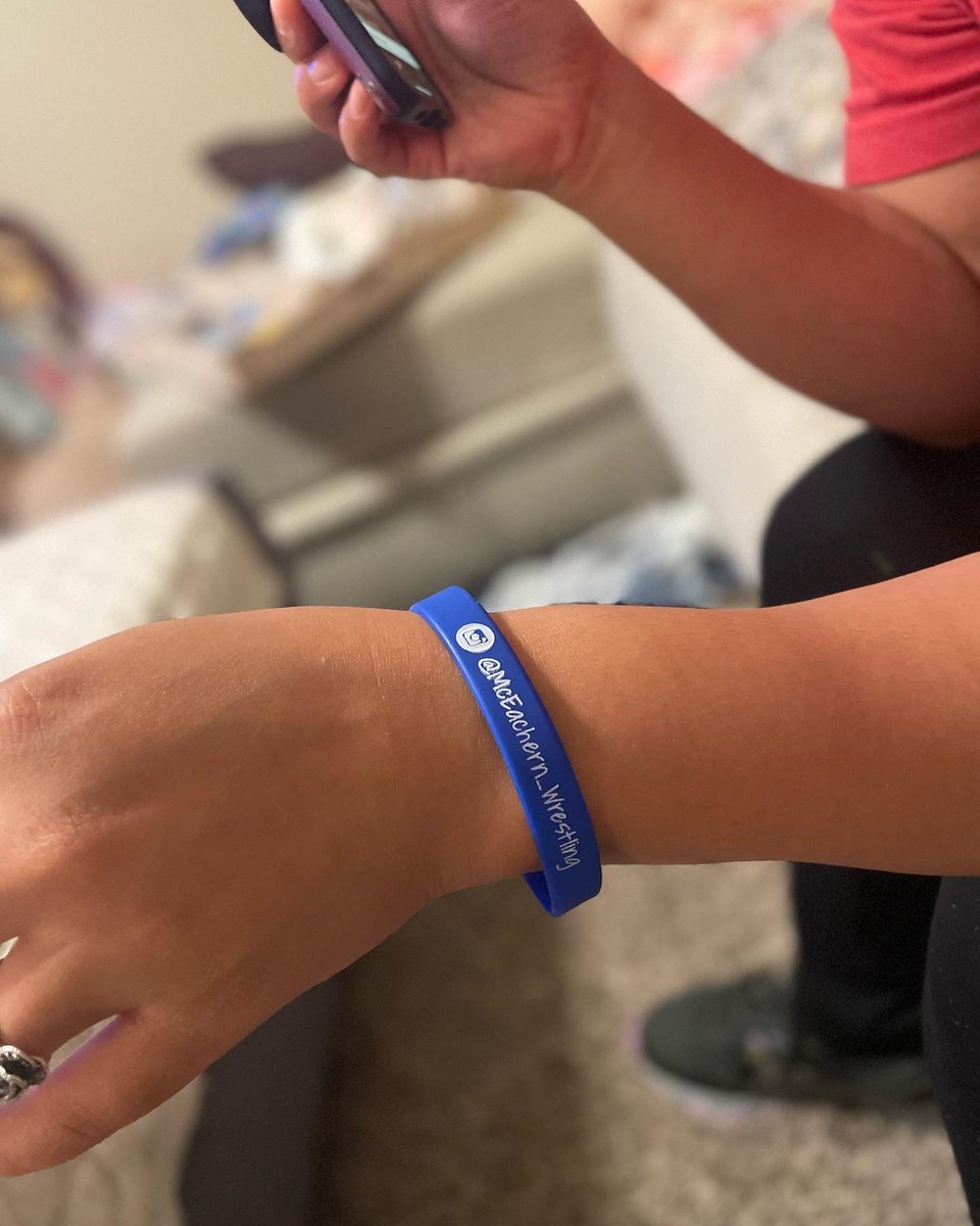 MCEwrestling's tweet photo. Stop by the Wrestling table at the block party Wednesday at 5pm in the bus lanes! 🔥  Buy a bracelet ($3) or a t-shirt ($5)!!! The bracelet says “Stick ‘em!!!” It means “pin him!” 🔥  Support us this season and yell “Stick ‘em!!!!” from the stands! @McEachernSports @McEachernHigh https://t.co/8GwQu71ErJ