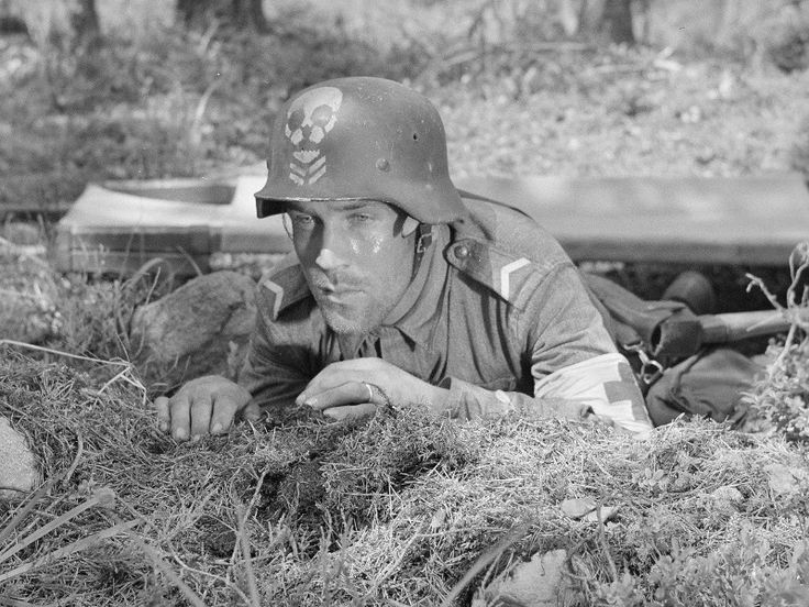 AccAxis's tweet photo. Finnish soldiers of light detachment Kevyt Osasto 4 with their eponymous skull emblazoned stahlhelms https://t.co/3eDOeoYU4S