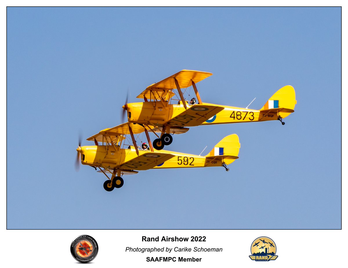 A #TigerMoth pair flown by Grant Timms and Steve 'Scuba' Brown at the #RandAirshow 2022
