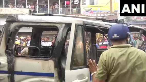 ANI's tweet photo. West Bengal | Police vehicle torched amid BJP's 'Nabanna Chalo' march against the state government, in Kolkata https://t.co/e6jqE3VIEs
