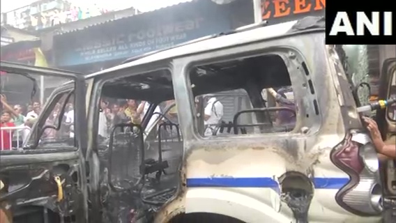 ANI's tweet photo. West Bengal | Police vehicle torched amid BJP's 'Nabanna Chalo' march against the state government, in Kolkata https://t.co/e6jqE3VIEs
