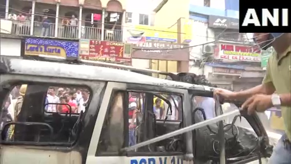 ANI's tweet photo. West Bengal | Police vehicle torched amid BJP's 'Nabanna Chalo' march against the state government, in Kolkata https://t.co/e6jqE3VIEs