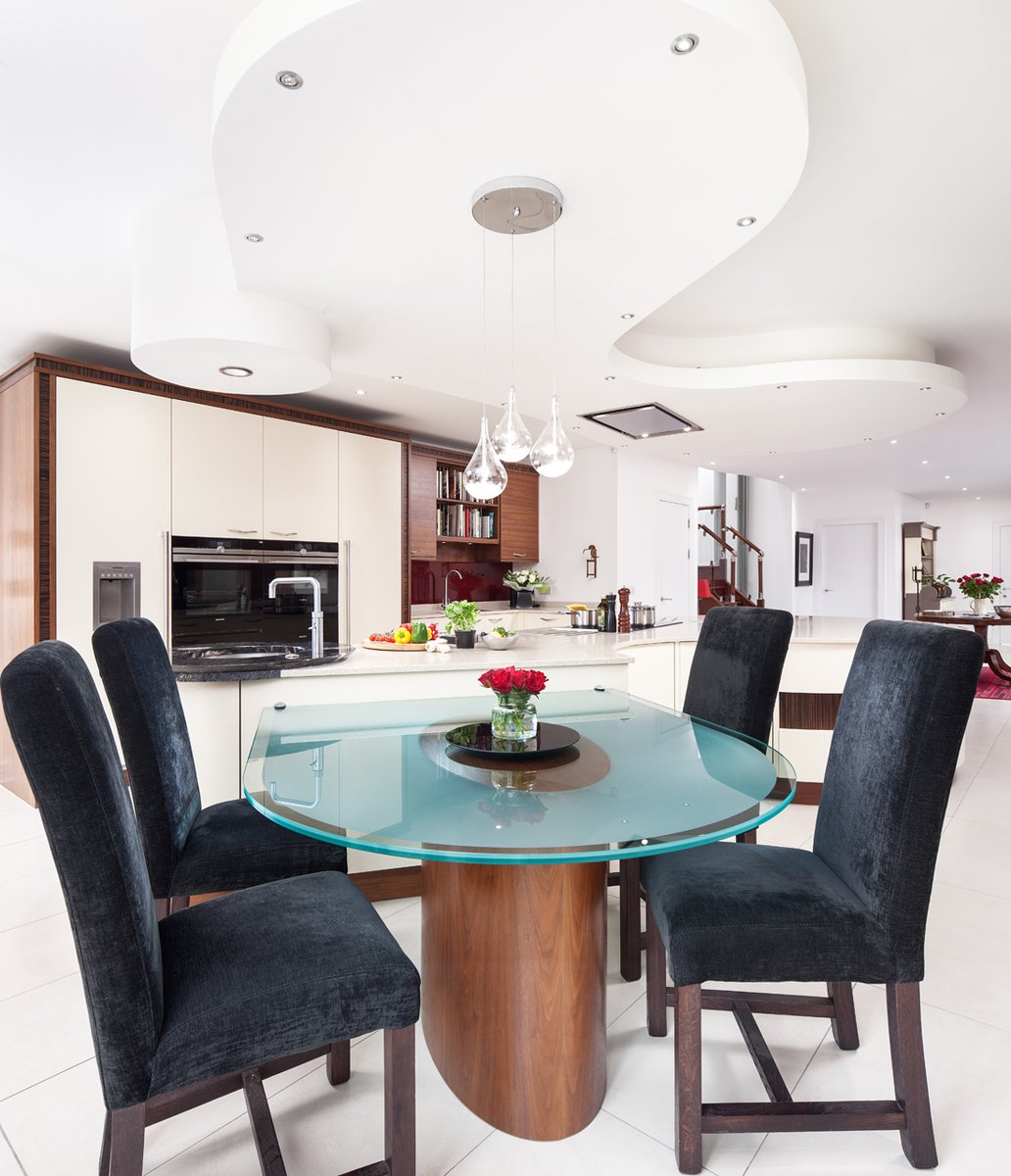 kitchensint's tweet photo. #kitchenofthemonth is this beautiful open plan kitchen, complete with curved @stonehamkitchen cabinetry, a really interesting dining table attached to the centrepiece island and stunning in-built drinks bar. The contrasting finishes make it the perfect kitchen. https://t.co/k9YzMyRksR