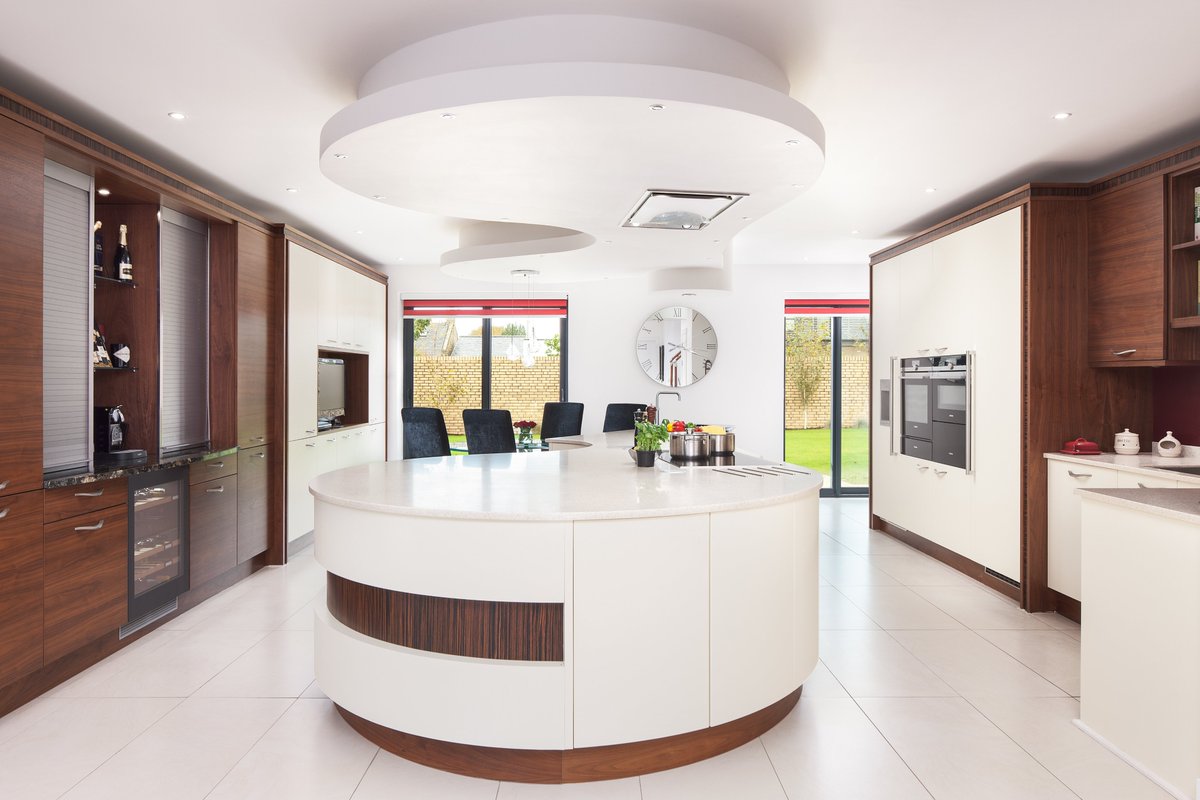kitchensint's tweet photo. #kitchenofthemonth is this beautiful open plan kitchen, complete with curved @stonehamkitchen cabinetry, a really interesting dining table attached to the centrepiece island and stunning in-built drinks bar. The contrasting finishes make it the perfect kitchen. https://t.co/k9YzMyRksR