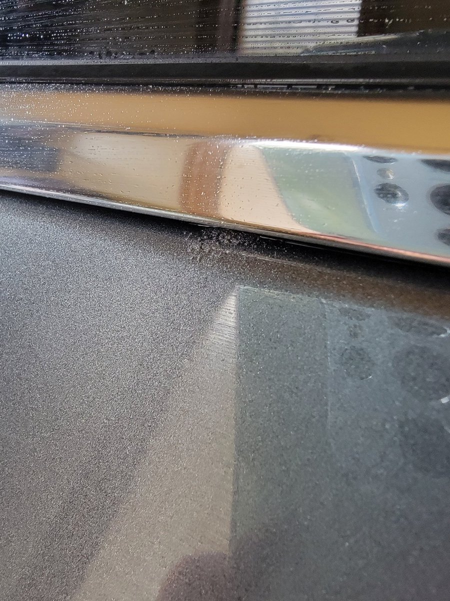 JasonBoardSmith's tweet photo. @Cadillac @GMcanada so disappointed in our 2022 XT6. We traded a 2020 XT6 for this one and at 2500km the SUV has to be repainted due to dirt in the paint as shown in pic 2, sunroof leaks as shown in pic 1 and the rear wiper motor housing leaks. Quality has gone downhill. :( https://t.co/OIa56JdCvS