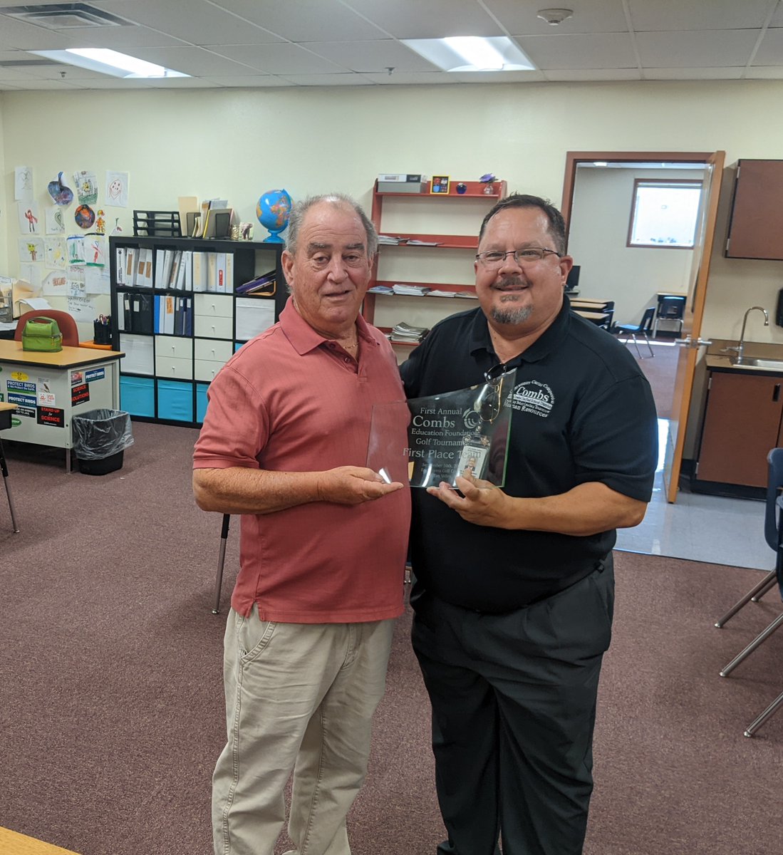 wyman_greg's tweet photo. Dr. Duplissis presents Jack Strubel w/his 1st place trophy from the Combs Foundation Golf Tournament.  We appreciate Jack &amp; all our employees who came out to support the tournament as players &amp; volunteers.  Love the team approach in @jocombsusd.  Great event! https://t.co/vSkZAk7NrT