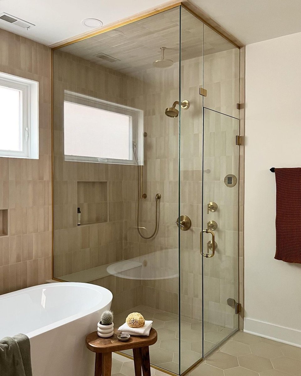 Neutral tones + textures in this bathroom create a warm and inviting feel! bit.ly/3Czknhr

Shower Tile: Makoto 2.5x10 in Tatami Beige

Designed by ainslie_design_studio