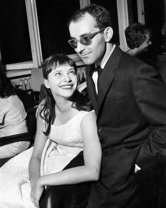 lenadunham's tweet image. Anna Karina looking up at Godard adoringly like we all have for so many years… RIP JLG- you filmed the things that made us flirt with new realms and we will miss you as you turn the next life black & white