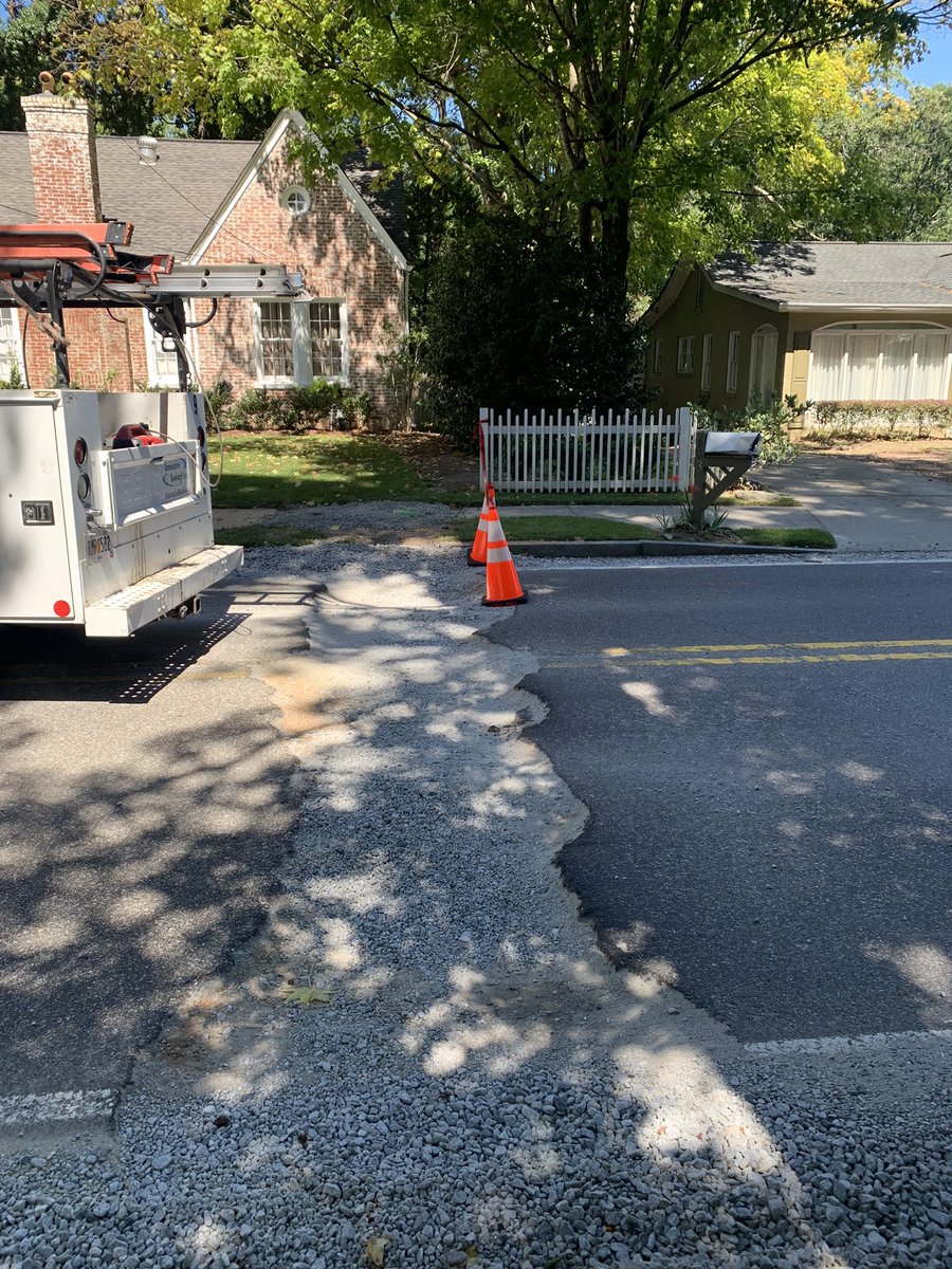 JoyParcells's tweet photo. Hi again @ATLDOT and @GADeptofTrans—still asking for help on Collier Rd NW.  Thankfully @ATLWatershed put up cones to warn drivers of the huge trench. But they were already knocked over once this afternoon.  Please provide something more substantial asap! https://t.co/n1XNwz6dCt