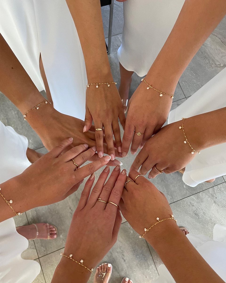 Created a set of bracelets for the maid of honour and bridesmaids.  Gold and 7 freshwater pearls representing each one.