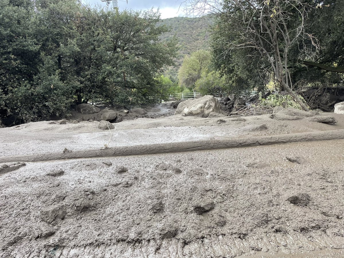 weatherechowx's tweet image. Power poles snapped by water with boulders and hanging wires #debrisflow