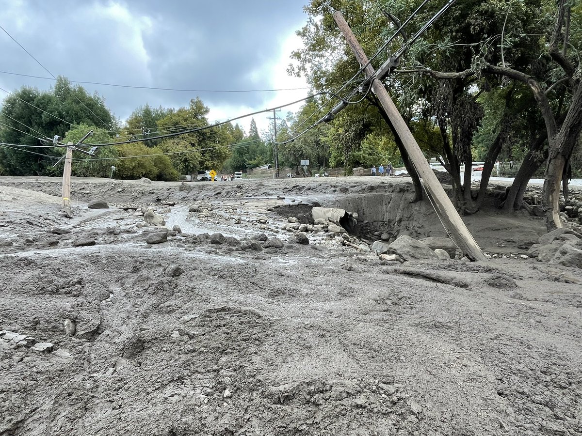 weatherechowx's tweet image. Power poles snapped by water with boulders and hanging wires #debrisflow