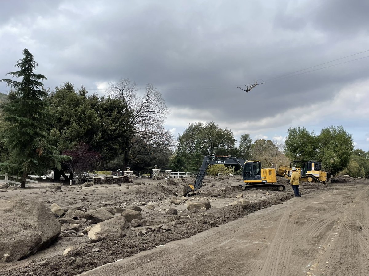 weatherechowx's tweet image. Power poles snapped by water with boulders and hanging wires #debrisflow