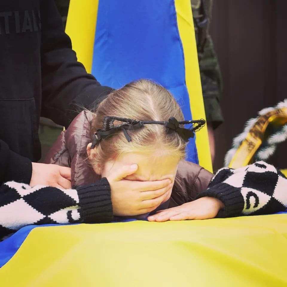 Photo by Olexiy Ladyka of Masha from Kramatorsk, crying over the coffin of her father, Artem Sinelnyk, a National Guard soldier. He was killed near Volokhiv Yar during a counteroffensive in the Kharkiv region.