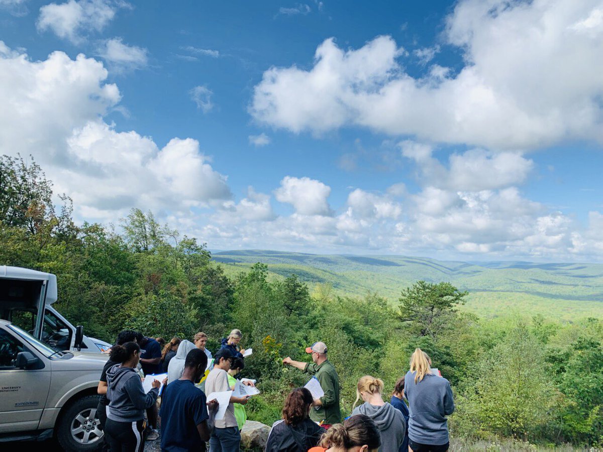 MartineBotany's tweet photo. Action shot by @melpsain from our #FieldBotany trip to Jones Mountain, Hook Natural Area. Incredible clear-day view of a good portion of the Buffalo Creek watershed — ideal conditions to discuss watershed concepts while looking right at one. #iamabotanist #iamanaturalist https://t.co/XazRGkKza1