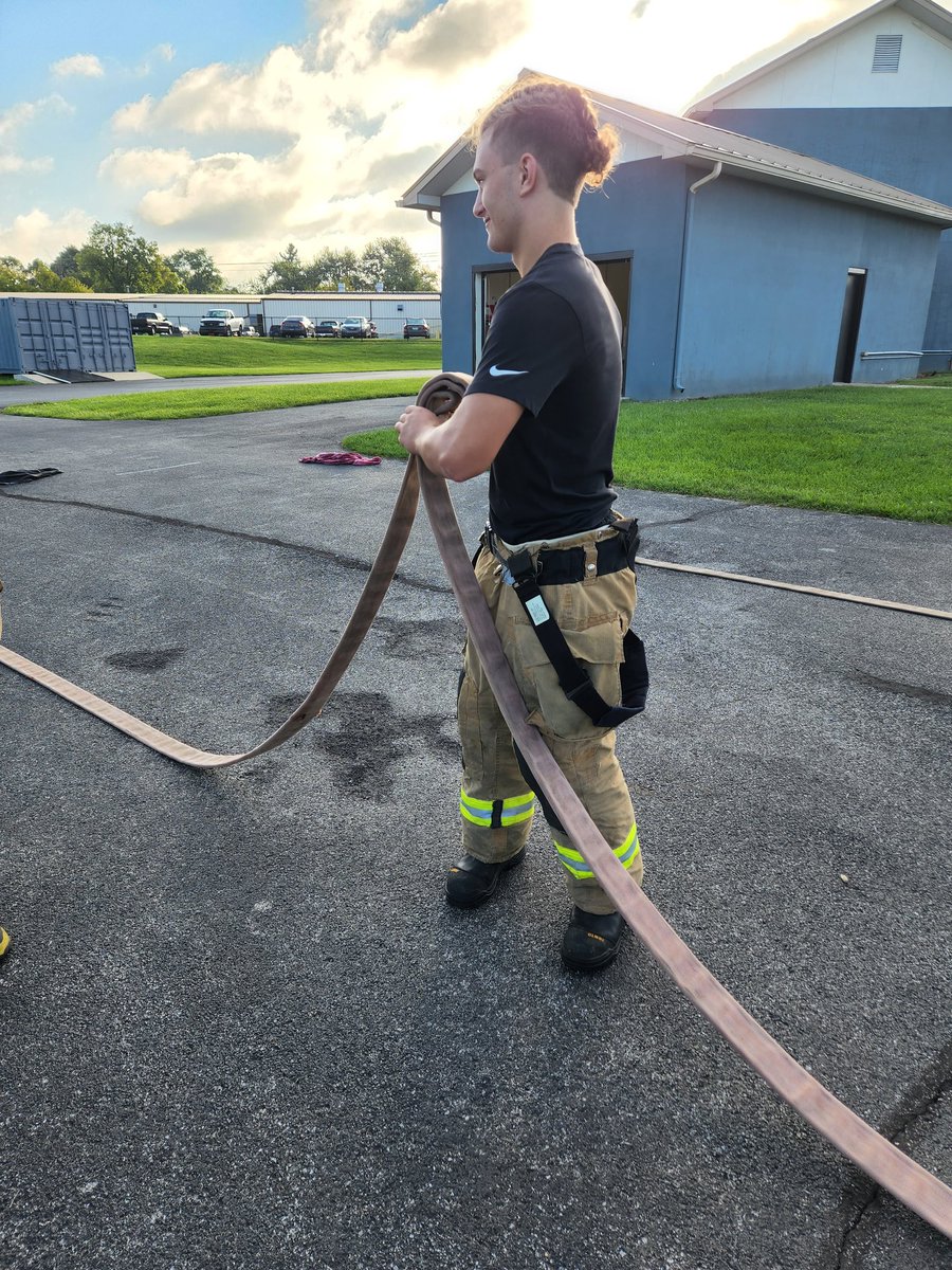 Company 2 students practicing hose rolls.