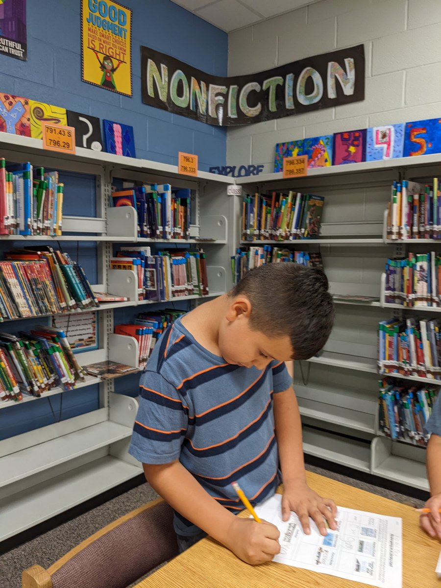 ..and now <a href="/MrsAGunther/">Mrs. Gunther</a> 's class is on a scavenger hunt! Looking for the sections of the library and finding the hidden word in that section. We ARE going to love library class this year! <a href="/D13Eagles/">Erickson Elementary</a>
