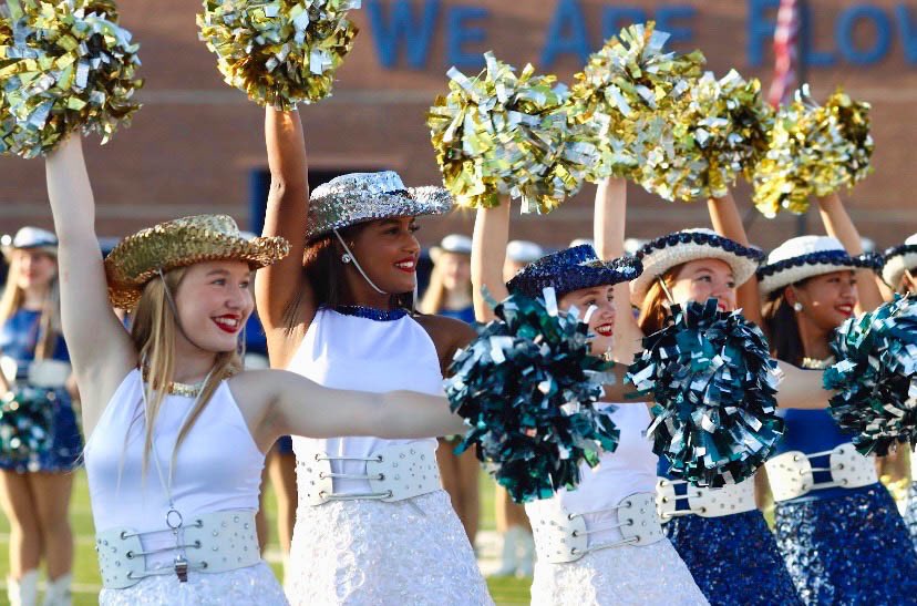 Photo of the Week: Before the football game against Flowermound, seniors captain Caitlin Hammack and first lieutenant Kassidy Claytor perform in their pregame line up. Photo by Jayla Colon.