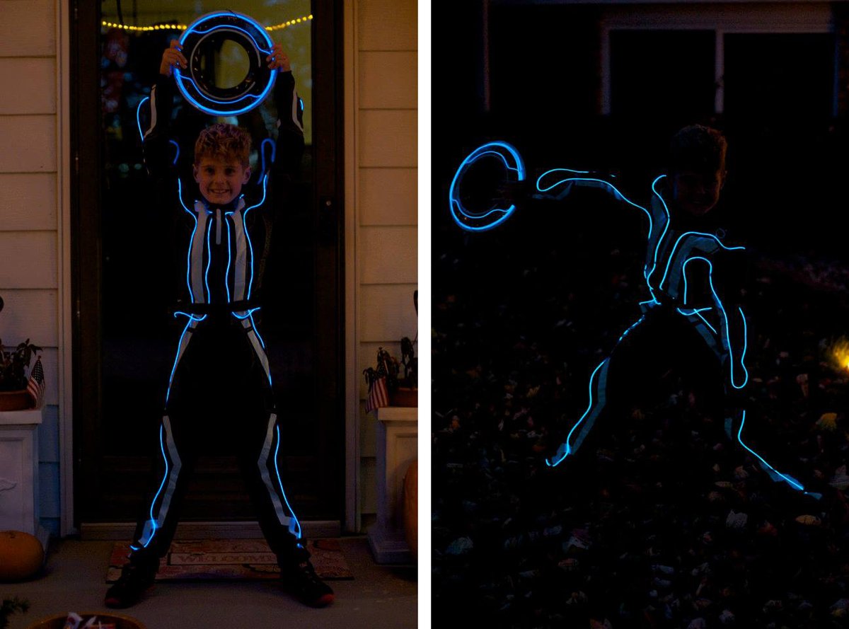 thisisamy's tweet photo. In honor of Tron's 40th anniversary... my son's costume in 2014. Bought the jumpsuit, and then I sewed a lighted wire to it and added one to Identity Disc. Can't wait to ride the Lightcycle! @DisneyD23 #TRON @Disney #D23Expo #Tron40 #DisneyParks https://t.co/zNKhlAiCnl