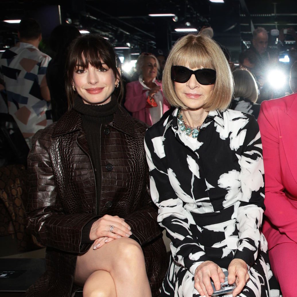 anne hathaway referencing herself from the devil wears prada (17 years ago) while sitting next to anna wintour at fashion week… the grip she has on me