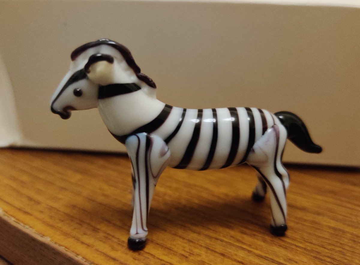 SteveDeanRefs's tweet photo. The other day, I posted about my glass Lucky Duck.

Well, in the same shop, they had other glass animals, and, well, you can see why I had to get this bad boy! 🦓

#zebra #referee #glassanimal #figurine https://t.co/NutcIkNrLK