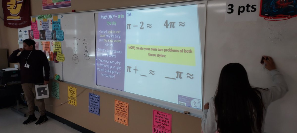 MisterWippel's tweet photo. With Math 360 (white boards around the room), students demonstrated their understanding of how to calculate approximations of expressions w/pi and square roots. They were assigned one question, then created one for another student to answer! @IMS_Indians @collierschools https://t.co/Bu7Ra3qoAx