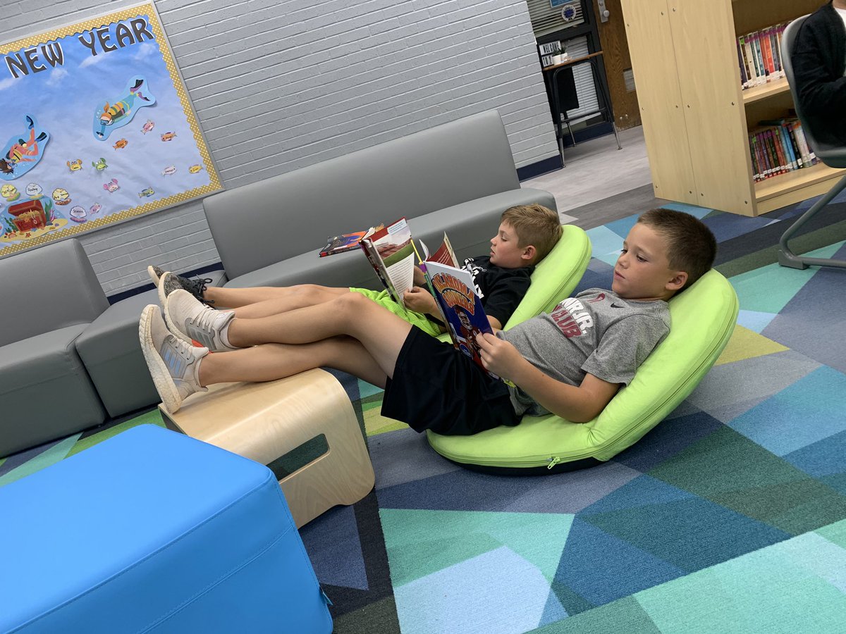 mandriaslee's tweet photo. 💙💛 📚 Getting comfy with a good book @ PES Library!  📚💛💙 https://t.co/FCQKvpoKU9