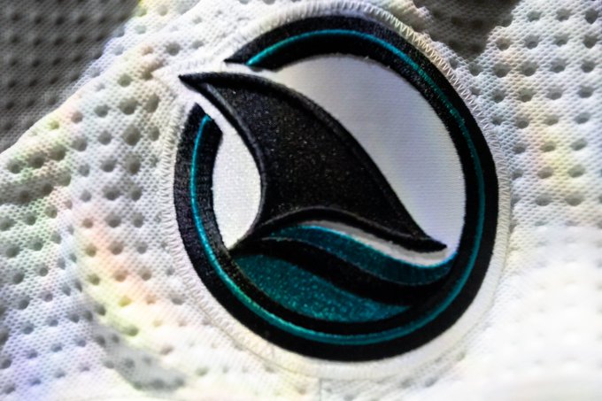 Up close of new fin logo on the away white jersey.