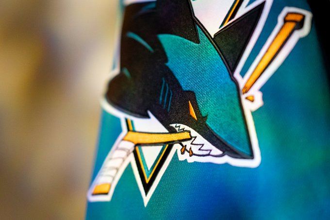 Up close of the Sharks logo on new Teal jersey